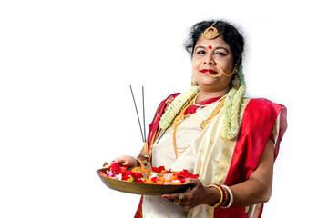 Indian Woman holding plate of religious offering , Durga Puja and Diwali Concept with Bengali woman.