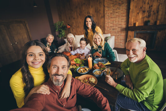 Self-portrait Of Attractive Cheerful Family Brother Sister Gathering Eating Festal Luncheon Meal Dish Autumn Fall Harvest Celebration Embracing At Modern Loft Brick Wooden Industrial Interior