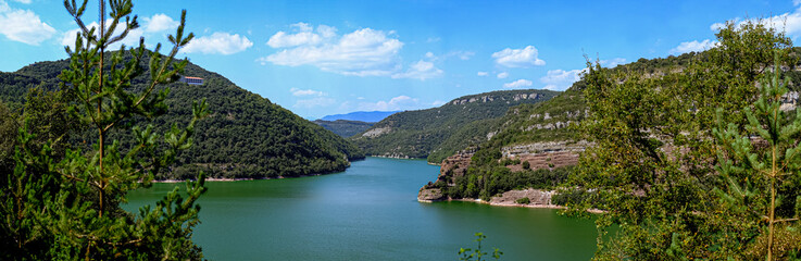 Nature landscape of a lake between mountains, hiking in Vilanova del Sau.