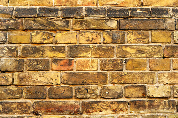 vintage brick wall in yellow. yellow brick wall texture for background..