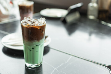 coffee and milk on ice glass