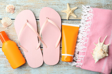 Beach objects on wooden background, flat lay
