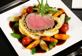 Beef Fillet Wellington on black Background
