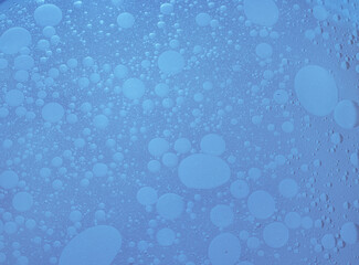 Texture of air bubbles in oil in water. Blue colour
