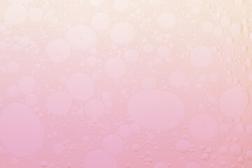 The texture of air bubbles in oil. Gradient from pink to white