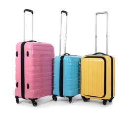 Stylish suitcases packed for travel on white background. Summer vacation