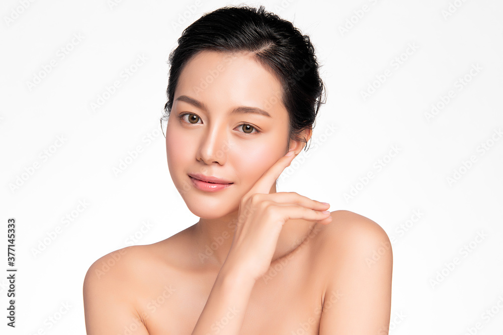 Wall mural beautiful young asian woman with clean fresh skin on white background, face care, facial treatment, 