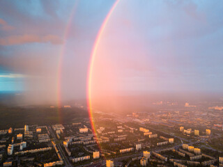 Naklejka premium Aerial drone view. Double rainbow on a rainy evening over Kiev city.