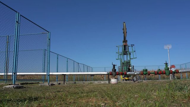Petroleum Industry Pump Jack Extracting Crude Oil from a Oil Well