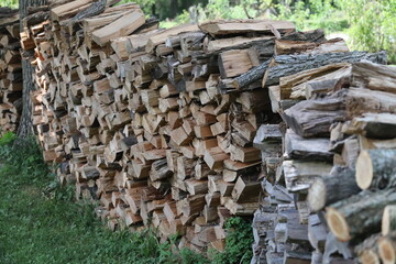 Neatly stacked and split firewood ready for wood burning stove