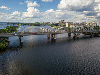 Fototapeta na wymiar Aerial drone view. Darnitsky railway and automobile bridge in Kiev.