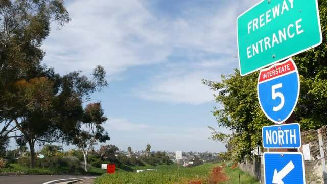 Freeway entrance, information sign on crossraod in USA. Route to Los Angeles, California. Interstate highway 5 signpost as symbol of road trip, transportation and traffic safety rules and regulations.