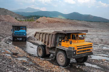 The mountainous dump truck is widely used for transporting and unloading rocks. Mining.