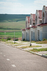 Fototapeta na wymiar A row of unfinished houses on the outskirts