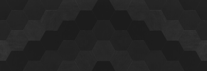 Fototapeta premium Abstract seamless black anthracite dark gray grey concrete cement stone tile wall made of hexagonal geometric hexagon print texture background banner panorama