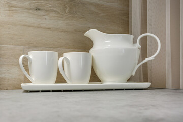 stylish vintage jars with different food and teapot in Interior of the modern kitchen apartment in minimalistic style