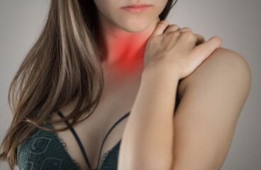 Sore throat in a woman. Highlighted in red. On a gray background. Close up