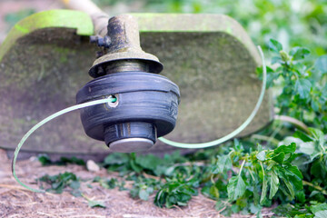 

electric mower on the grass close up