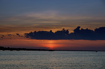 Amazing sunset with endless colorful horizon ocean