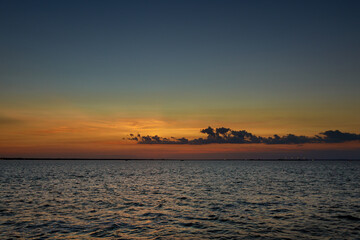 Fototapeta na wymiar Sunrise over the ocean with beautiful cloudscape