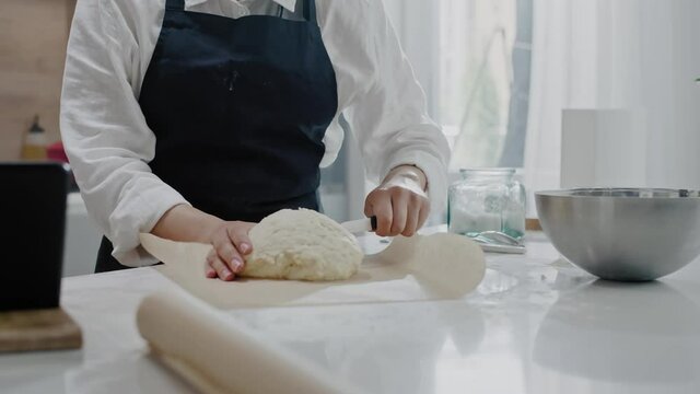 Professional Baker Makes Final Touches of Cooking Bread.
