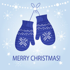 Cozy knitted blue mittens with ornaments and snowflakes. Warm clothes to protect hands from cold in winter. Against the background of white snowflakes. New Year's holiday and Christmas mood. Vector fl