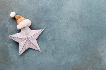 Fototapeta na wymiar Christmas decoration. Christmas star on rustic dark background.