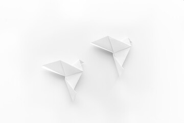 Paper pigeons in origami technique. DIY creativity. View from above