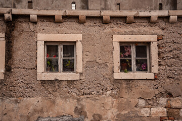 Fototapeta na wymiar Two Windows in old house in Dubrovnik, Crotia