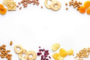 Frame of nuts overhead with dried fruits and other snacks top view