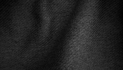 macro view of dark black fabric texture, wavy wrinkled cloth pattern. soft linen fabric background.