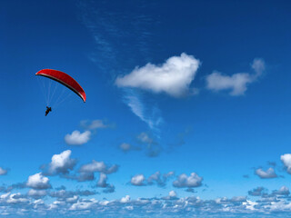 paragliding in the blue sky