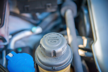Power Steering fluid tank of a car close up