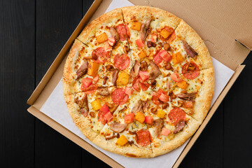 Pizza with pumpkin, sausage, bacon and honey mushrooms