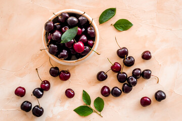 Berries in the bowl. Red cherry top view, copy space