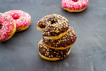 Chocolate donuts close up. Glazed and sprinkles bakery