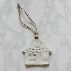 decoration in the form of a house made of air-dry white clay, hand made, wall hanging, housewarming gift, moving to a new house, a memorable gift,  tree ornament