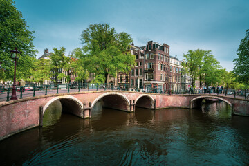 Amsterdam canals with bridge and typical houses, Holland