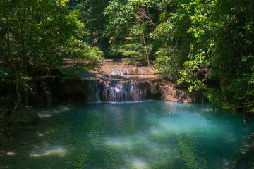 Clear stream that flows through the rocks. Falling into the Emerald Pool, Erawan Kanchanaburi, Thailand.