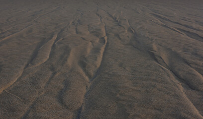 Abstract view of a big flat Namib Desert dune surface with a windswept pattern