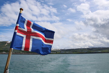 Fototapeta premium National Flag of Iceland blowing in the wind