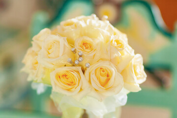 wedding rings on bridal bouquet