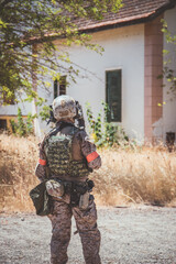 Soldier in a combat situation. Men play airsoft.