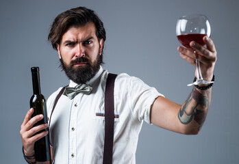 delicious alcoholic drink. stylish sommelier tasting beverage. old fashioned bearded hipster...