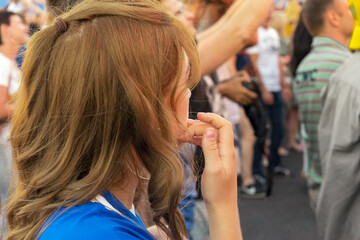 Fototapeta premium young girl at a mass event
