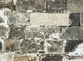Old medieval brick gray wall