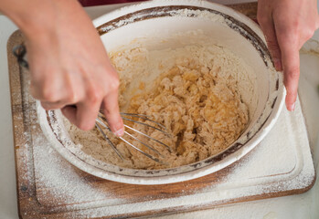 Making food special. kid chef cooking making dough. child prepare healthy food at home and wearing cook uniform. housekeeping and home helping. childhood development. small girl baking in kitchen