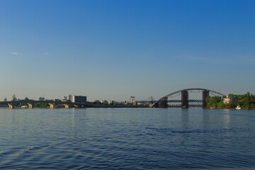 Fototapeta na wymiar Bridge over the big river in the city