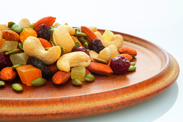 The plate contains nutritious mixed nuts