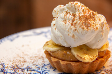 Banoffee Pie. Traditional English dessert prepared with banana and dulce de leche or caramel